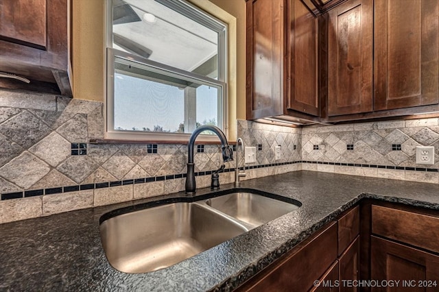 kitchen with backsplash and sink