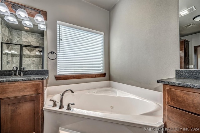 bathroom with vanity and plus walk in shower