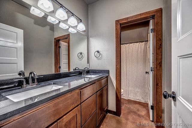 bathroom with vanity and a shower with shower curtain