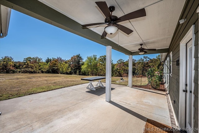 view of patio featuring ceiling fan