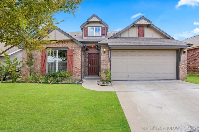 view of front of home featuring a front lawn and a garage