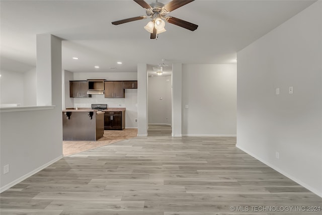 unfurnished living room with light hardwood / wood-style floors and ceiling fan