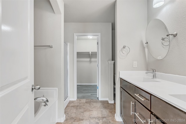 bathroom with vanity and plus walk in shower