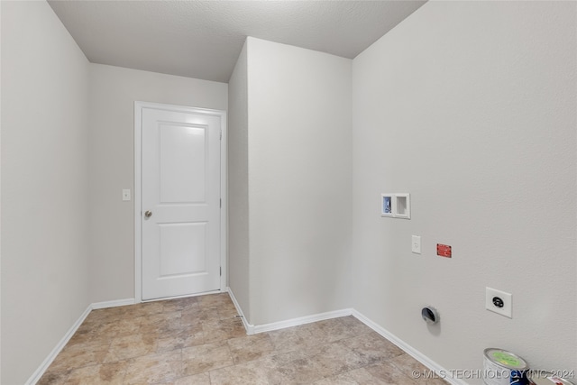 laundry room with a textured ceiling, washer hookup, and hookup for an electric dryer