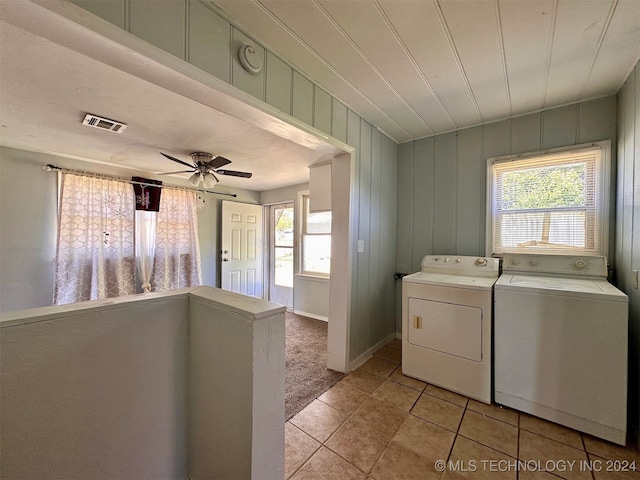 washroom with washer and clothes dryer, ceiling fan, and light tile patterned floors