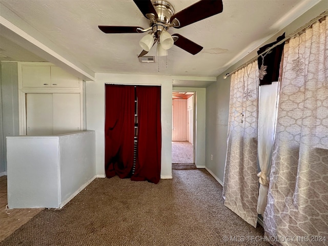 corridor featuring carpet floors