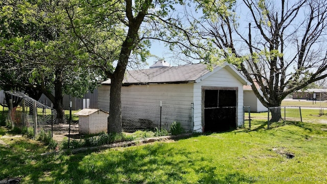 view of outdoor structure with a lawn