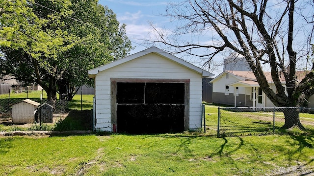 garage featuring a lawn