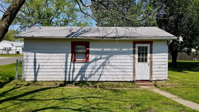 garage featuring a yard