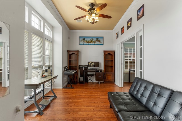 office space with ornamental molding, hardwood / wood-style floors, and ceiling fan