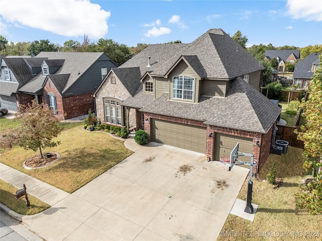 view of front facade with a front lawn and a garage