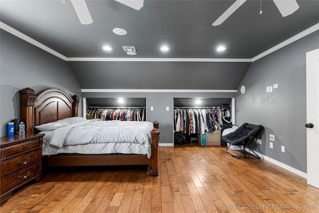 bedroom with lofted ceiling, crown molding, light hardwood / wood-style floors, and ceiling fan