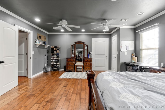 bedroom with light hardwood / wood-style floors, crown molding, a textured ceiling, and ceiling fan