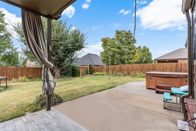 view of patio / terrace with a hot tub