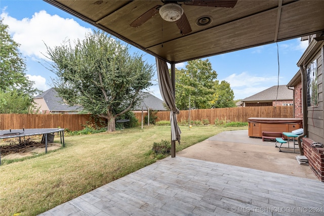 view of patio / terrace featuring a hot tub and ceiling fan