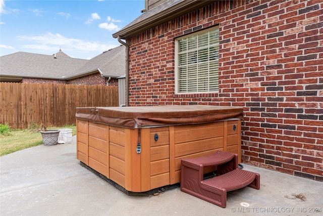 view of patio with a hot tub