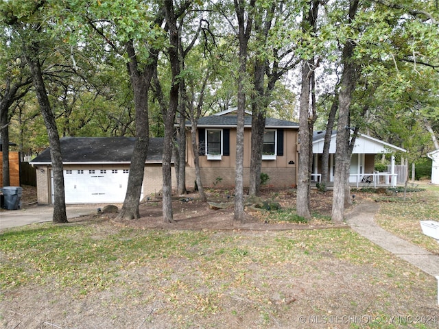 view of front of home with a garage and a porch