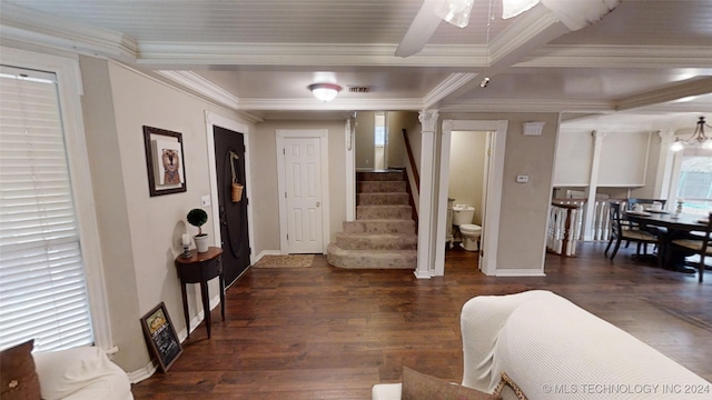 entryway with ceiling fan, ornamental molding, dark hardwood / wood-style floors, beamed ceiling, and ornate columns