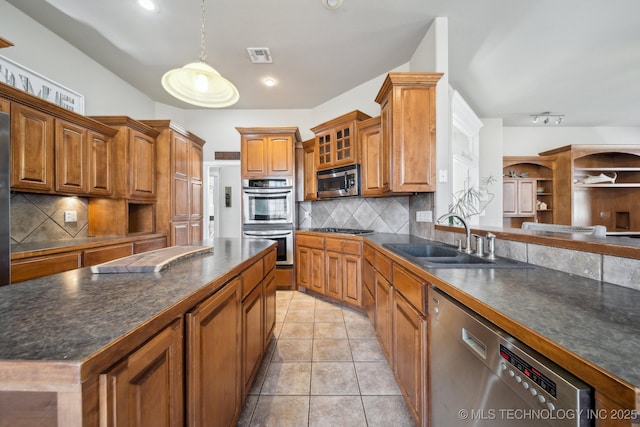 kitchen featuring sink, light tile patterned floors, hanging light fixtures, backsplash, and stainless steel appliances