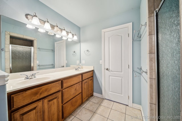 bathroom featuring tile patterned floors, a shower with shower door, and vanity