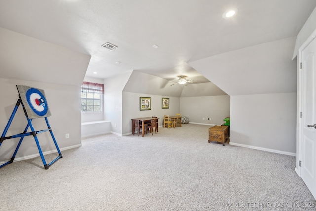 playroom featuring light carpet and vaulted ceiling