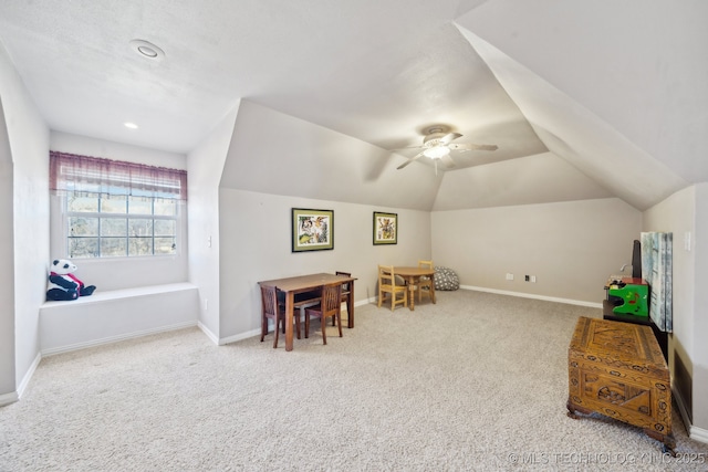 playroom with vaulted ceiling, light carpet, and ceiling fan