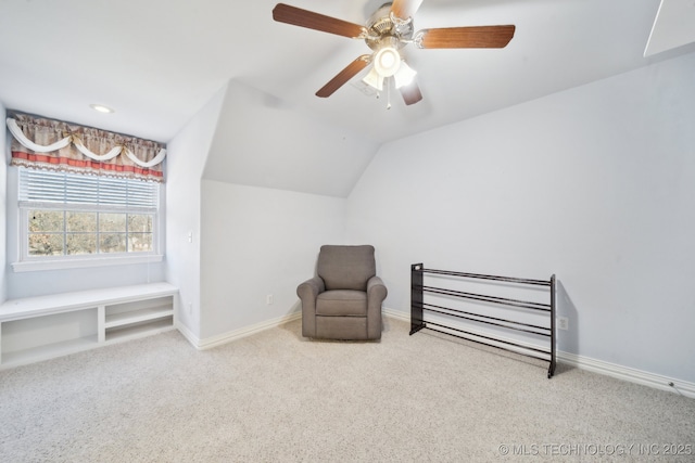 sitting room featuring lofted ceiling, carpet flooring, and ceiling fan