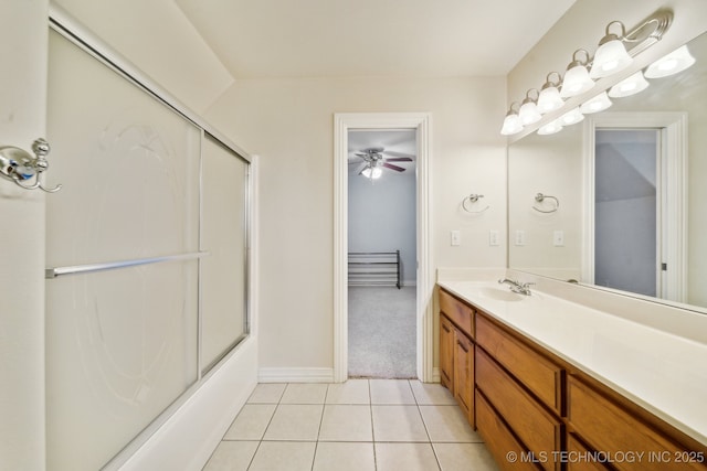 bathroom with vanity, tile patterned floors, and enclosed tub / shower combo