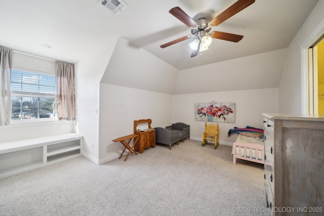 carpeted bedroom with vaulted ceiling and ceiling fan