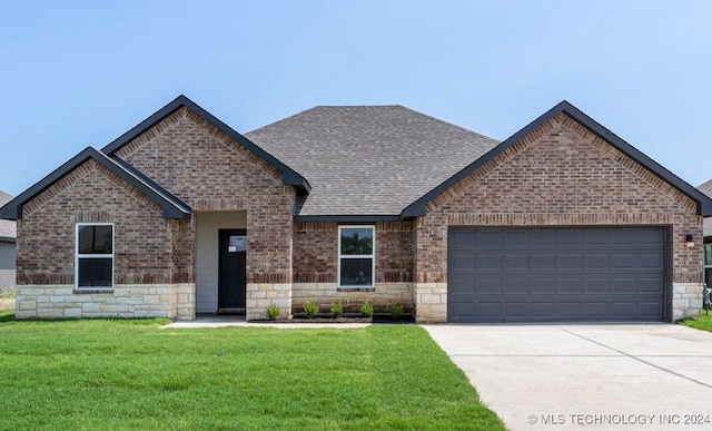 view of front facade with a front lawn and a garage