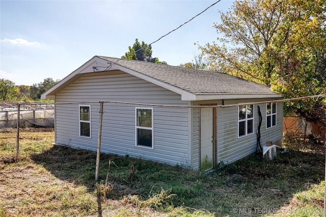 view of home's exterior with a lawn