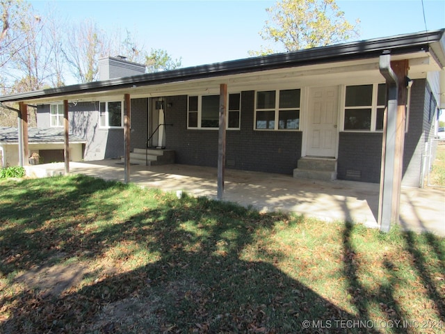 back of house with a yard