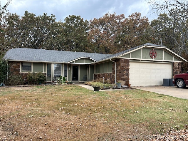 ranch-style home with a front yard and a garage