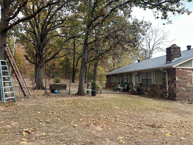 view of yard with a sunroom