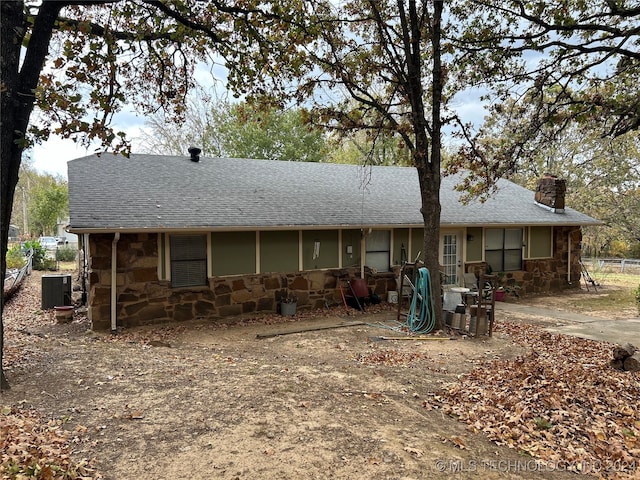 back of property featuring central AC unit