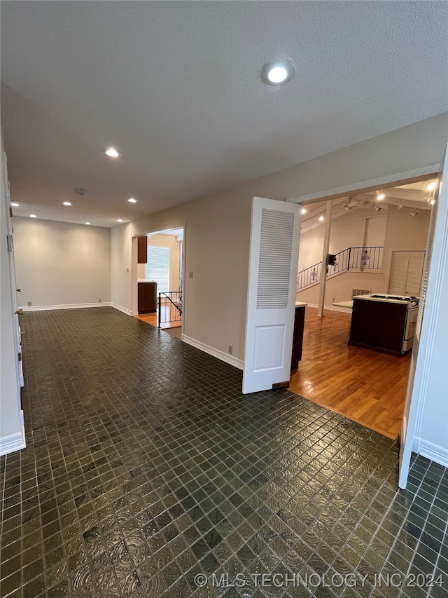 unfurnished living room with dark hardwood / wood-style floors