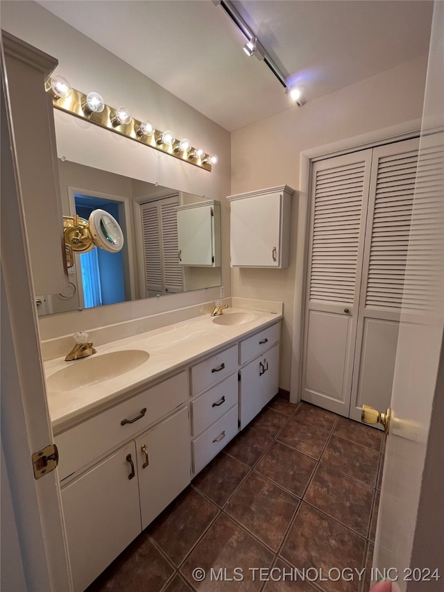 bathroom featuring vanity and tile patterned flooring