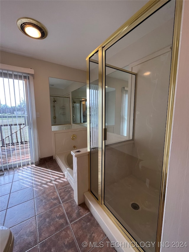 bathroom featuring shower with separate bathtub and tile patterned floors