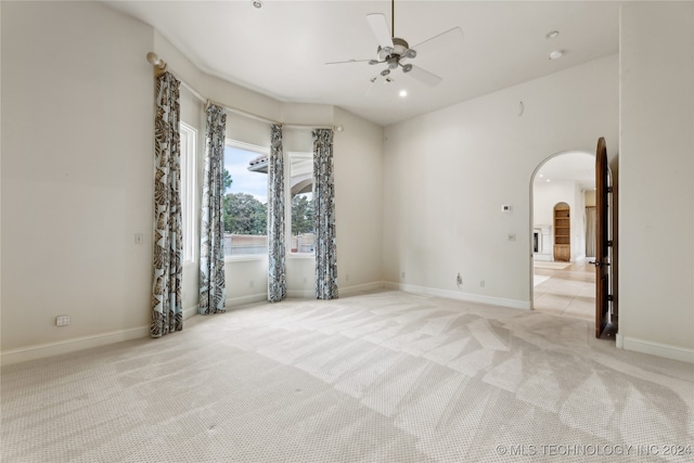 unfurnished room with light carpet and ceiling fan