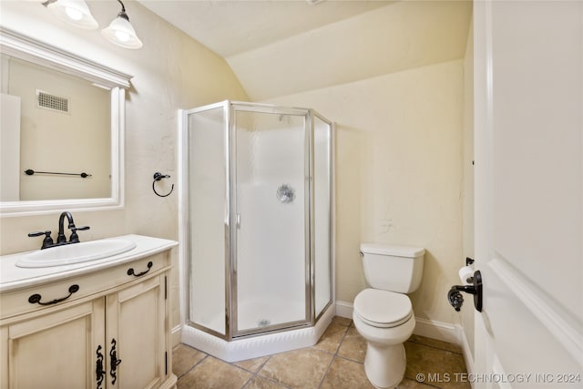 bathroom featuring vaulted ceiling, toilet, a shower with shower door, vanity, and tile patterned flooring