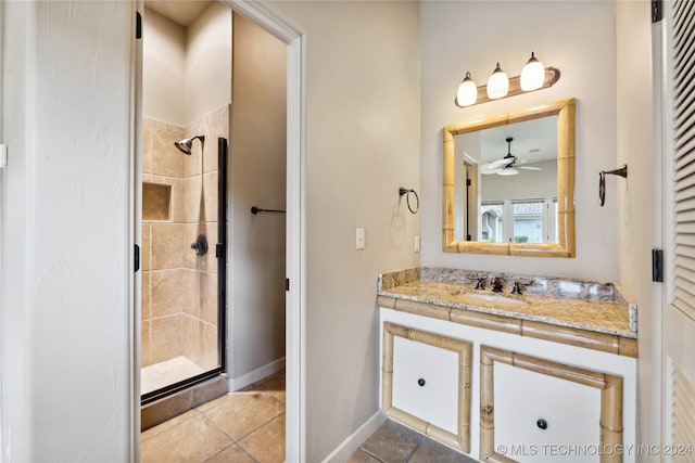 bathroom featuring vanity, ceiling fan, tile patterned floors, and a shower with shower door