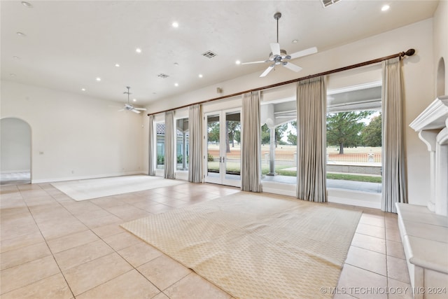 tiled spare room featuring ceiling fan