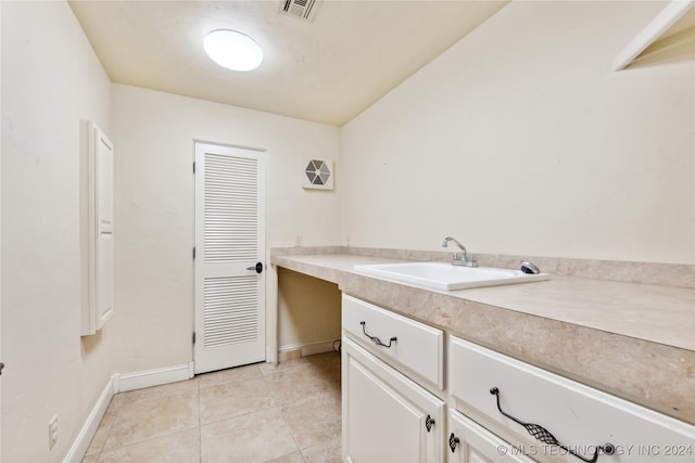 bathroom with vanity and tile patterned flooring