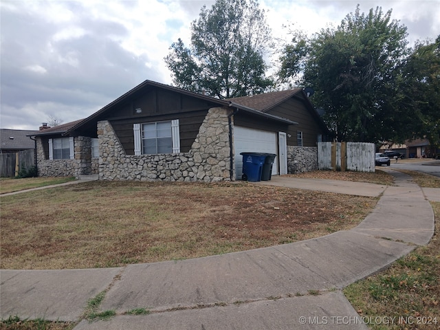 exterior space featuring a front yard and a garage