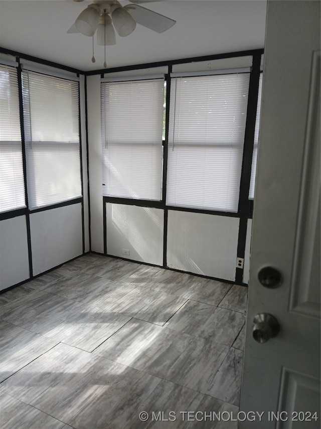 interior space featuring ceiling fan