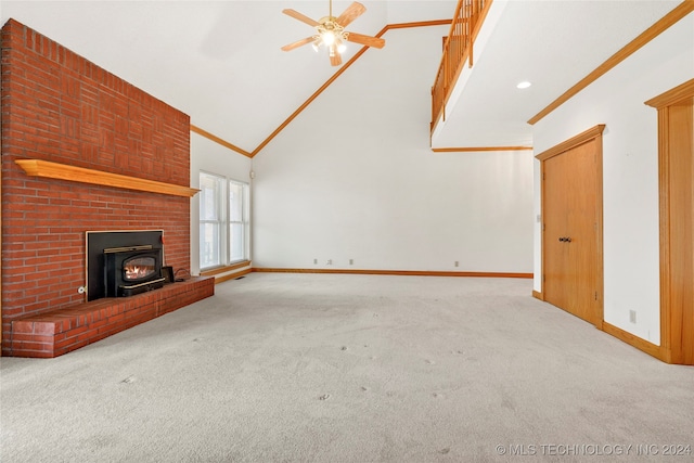 unfurnished living room featuring light carpet, high vaulted ceiling, crown molding, and ceiling fan