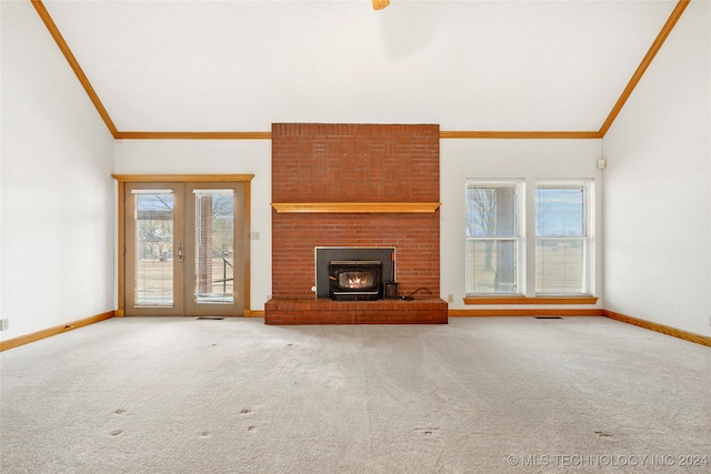 unfurnished living room featuring french doors, high vaulted ceiling, carpet flooring, and ornamental molding