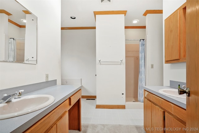 bathroom with vanity, crown molding, curtained shower, and tile patterned floors