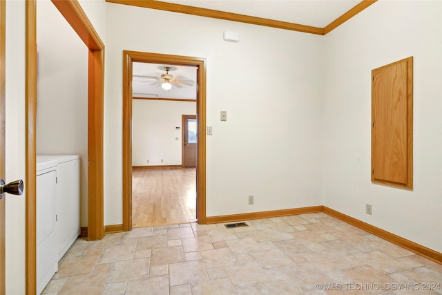 spare room featuring crown molding, washing machine and clothes dryer, and ceiling fan