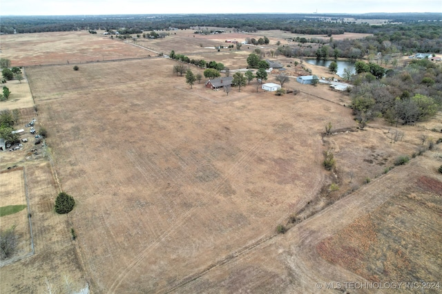 bird's eye view with a water view and a rural view